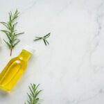 Rosemary Oil Bottle With Rosemary Plants Iih